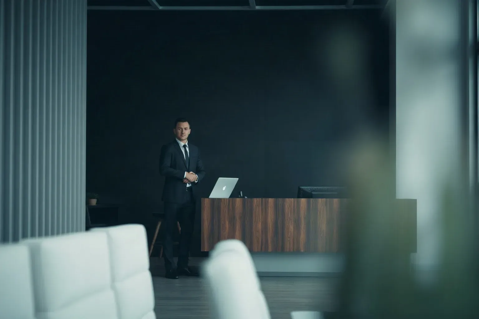 A small-business reception area with a desk and waiting chairs
